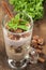 Cocoa dessert with yogurt , nuts and mint