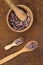 Cocoa flat lay  concept with raw cocoa beans in bowl and spoon on iron  background