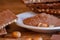 Cocoa, hazelnut and chocolate with hazelnut on wooden table