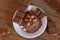 Cocoa, hazelnut and chocolate with hazelnut on wooden table