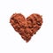 Cocoa powder or coffee in the shape of a heart.