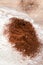 Cocoa powder sifting into white flour, bakery process