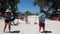 CocoCay, Bahamas 11th April 2019: People doing limbo dancing on a beautiful tropical beach at Little Stirrup Cay or Coco Cay,