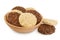 coconut and amaranth cookies with carob in wooden bowl isolated on white background with full depth of field. Healthy