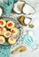 Coconut baking theme flat lay creative layout overhead with baked macaroons.