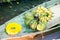 Coconut, banana and yellow garland on wooden ship