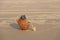 A coconut on the beach wearing sunglasses plays on a gold alto s