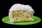 Coconut cake piece on green plate