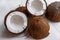 Coconut chopped half on a wooden background of blue tseta. Tropical background with place for copy space. View from above