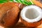 Coconut with coconuts green palm tree leaf closeup. Beauty treatments. Coco nut close-up. Healthy Food, skin care concept