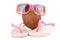 Coconut concept with sunglasses and beachwear