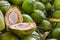 Coconut divided in half on a heap of coconuts. Selective Focus.