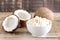 Coconut Flour in a White Bowl Coconuts Wooden Background Gluten Freee Flour Horizontal