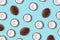 Coconut fruit on a pastel blue background. Minimal summer conce