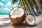 Coconut juice or cocktail with a straw on a sand beach, blue sky background and palm trees. Beautiful summer seascape. Vacation