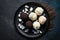 Coconut Macaroons On Black Matte Plate. Generative AI