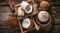 Coconut oil, natural handmade coco soap and fresh coconuts on wooden background top view. Spa body care concept