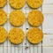 Coconut Orange Biscuit Cake Cut Outs on Cooling Net