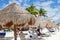 Coconut Palm Leaf Beach Umbrella With Beachgoers in Mexico