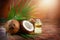 Coconut palm oil in a bottle with coconuts and green palm tree leaf on brown background. Coco nut closeup. Healthy Food, skin care