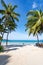 Coconut palm trees and turquoise sea in phuket patong beach. Summer nature vacation and tropical beach background concept Vertical