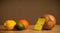 Coconut with post-it note looking at citrus fruits