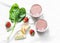 Coconut probiotic yogurt, spinach, apple, strawberry detox smoothie on a light background, top view. Healthy diet food concept.
