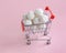 coconut round candies in a mini shopping basket, isolate on