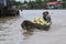 Coconut seller on a boat with coconuts in a floating market on the Mekong river in Vietnam