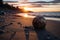 a coconut shell on the beach at sunset