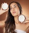 Coconut skincare, woman and studio for health, wellness and natural radiant glow by backdrop. Model, face and