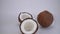 Coconut split with a knife into two parts. Coco, ripe palm fruit. nut is useful, improves the condition of the body in many diseas