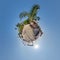 coconut trees in jungle in Indian tropic village on sea shore on little planet in blue sky, transformation of spherical 360