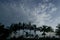 Coconut trees are in line with sky background