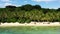 Coconut trees on a white beach. Caramoan Islands, Philippines.