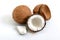 Coconut on a white background. Whole coconut, halves, shells, pieces of coconut