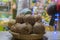 Coconuts in a basket in a bazaar. Pile of coconuts in the basket at the market