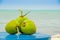 Coconuts on a table by the beach in livingston