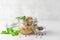 Cod liver in a jar with parsley and pepper on white background. Natural source of omega 3 and vitamin D. close up