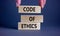 Code of ethics symbol. Wooden blocks with words \\\'Code of ethics\\\'.