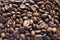 Cofe. Roasted coffee beans. Brown background texture