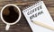 COFEE BREAK text on notebook with coffee on wooden background