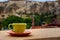 Coffe cup on the balcony overlooking Uchisar Mountain in Cappadocia