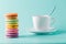 Coffe cup with colorful french macaron