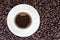 Coffee background with beans and white cup. copy space.