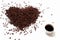 Coffee background. Scattered coffee beans on an empty white background in the shape of a heart. Heart of roasted brown coffee