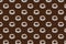 Coffee background. Trendy seamless pattern of white cups on brown backdrop
