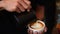 Coffee barista make espresso shot from coffee maker hot cup. Cappuccino with milk in italian coffee shop cafe. Close up hands of b