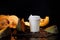 Coffee bean pumpkin spice latte nutrition recipie mock up. cut pumpkin coffee beans and white paper cup for coffee break