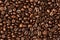 Coffee beans background macro. Dark Roasted coffee beans textured wallpaper